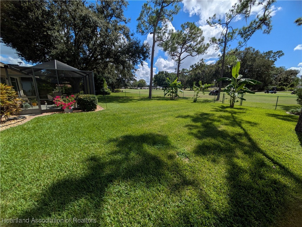 2708 Par Road Sebring, FL 33872 - Photo 26 of 33 a view of a park with swings and slides