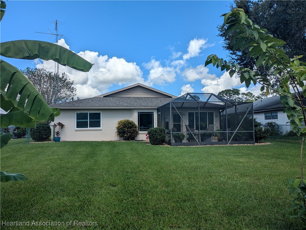 2708 Par Road Sebring, FL 33872 - Photo 28 of 33 a front view of a house with a garden
