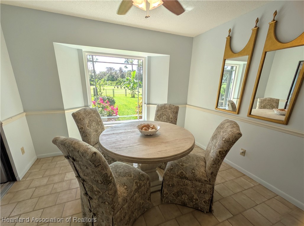 2708 Par Road Sebring, FL 33872 - Photo 8 of 33 a dining room with furniture and wooden floor