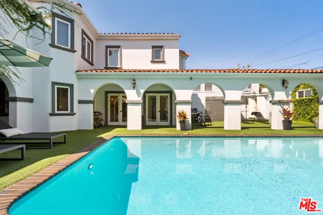 a view of a patio with swimming pool