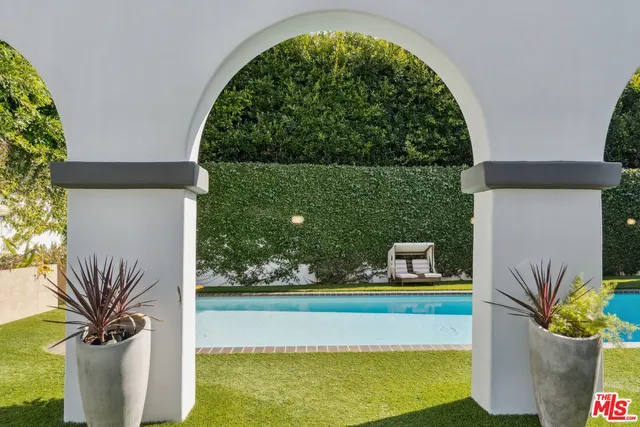 a view of a two chairs in the patio