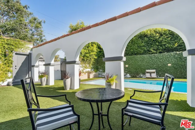a patio with table and chairs
