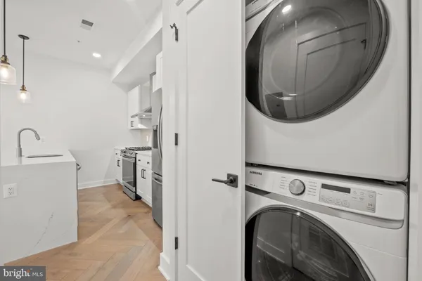 a view of a hallway with washer and dryer