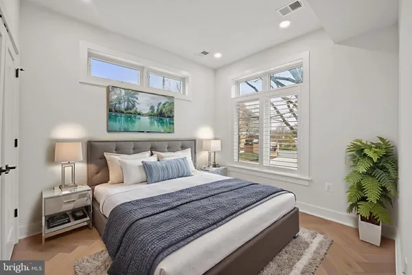 a bedroom with bed and a window
