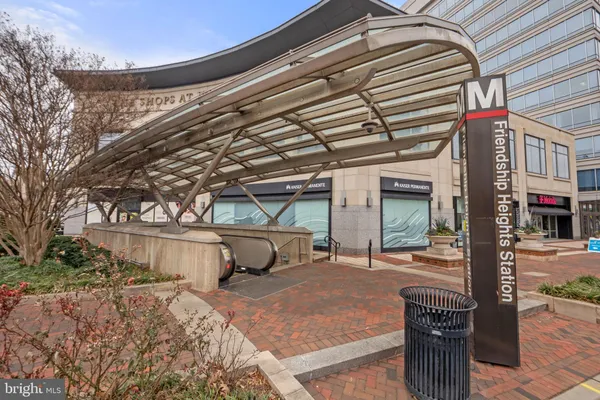 a front view of a building with sitting area