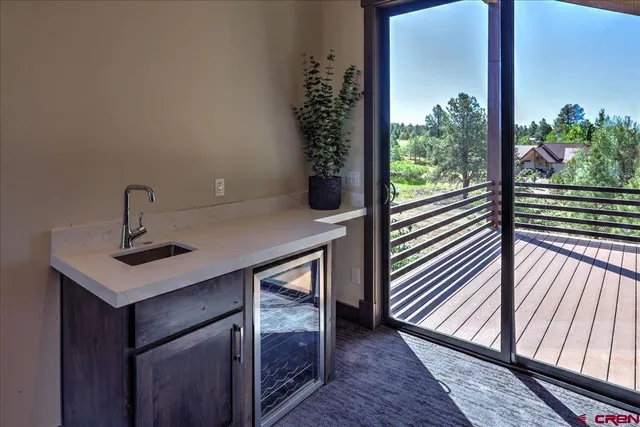 a view of a room with a porch and furniture