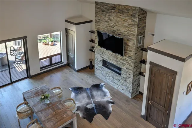 a view of a balcony with mountain view and wooden floor