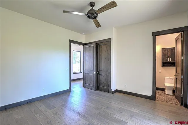 a view of empty room with floor to ceiling window