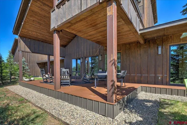 a view of house with outdoor space and parking