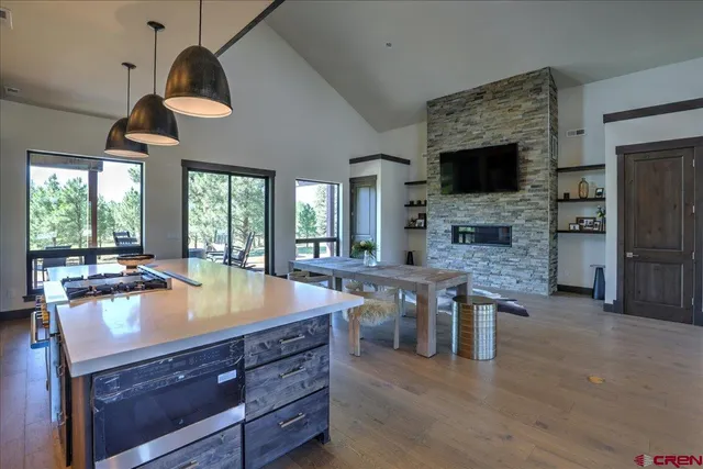 a kitchen with stainless steel appliances granite countertop a sink and a stove