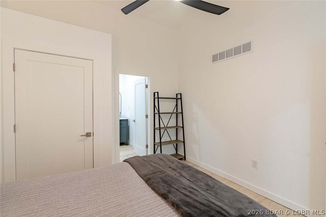 131 Frudeger Road Lake Ozark, MO 65049 - Photo 25 of 78 Closet and door to bath in main level suite