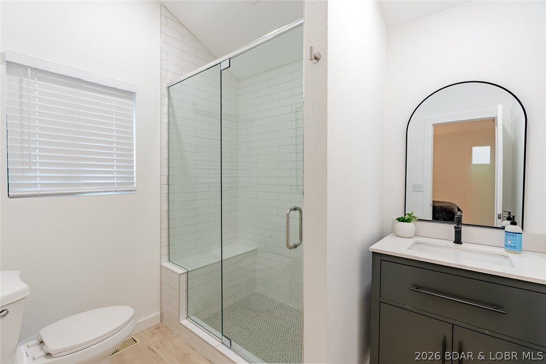 131 Frudeger Road Lake Ozark, MO 65049 - Photo 26 of 78 Main floor suite bathroom - custom vanity and tile