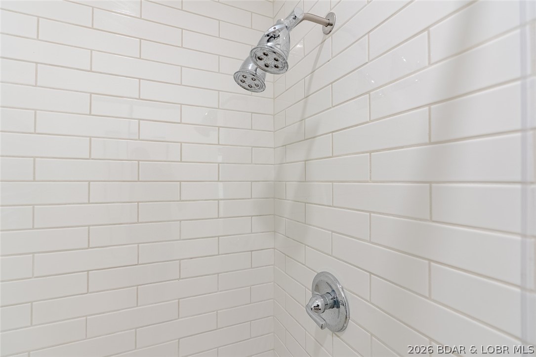 131 Frudeger Road Lake Ozark, MO 65049 - Photo 29 of 78 Tile shower main floor suite