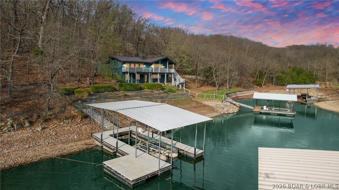 131 Frudeger Road Lake Ozark, MO 65049 - Photo 4 of 78 17mm in the back of a calm cove with 2 private doc