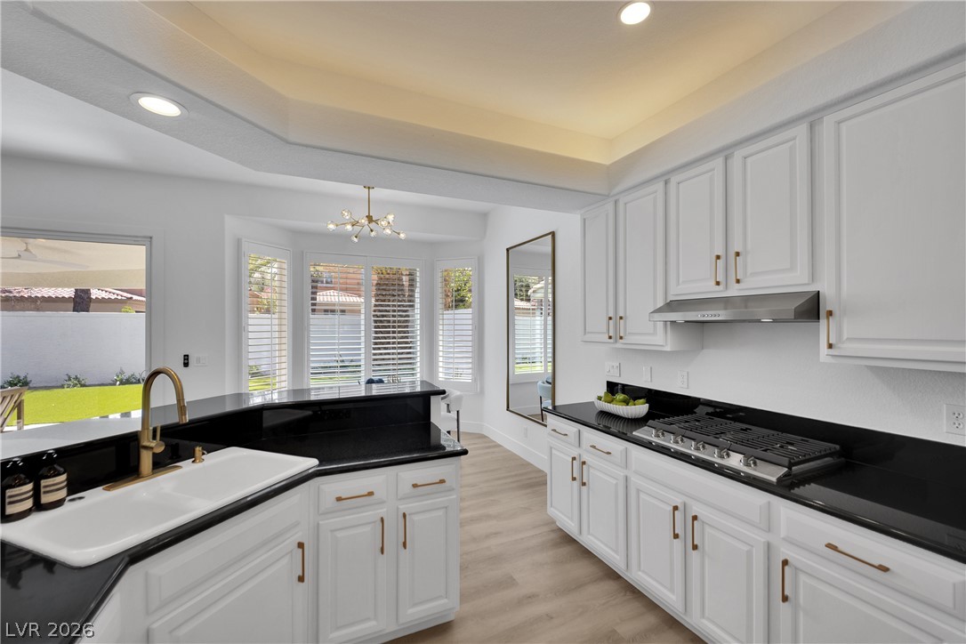 8981 Rivers Edge Drive Las Vegas, NV 89117 - Photo 21 of 69 Culinary delights await in this bright kitchen with modern amenities and ample counter space.