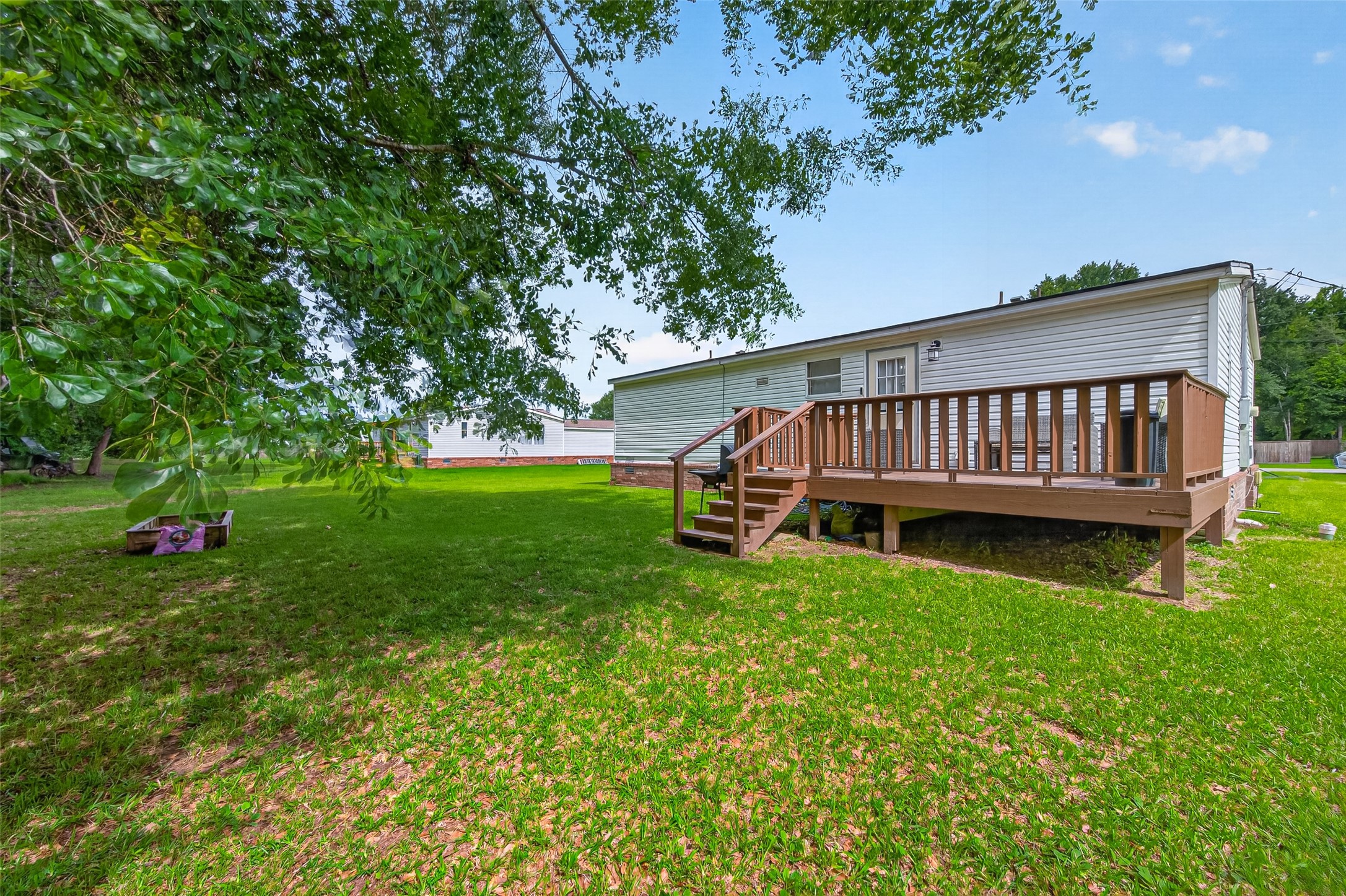 16572 River Ranch Drive Conroe, TX 77302 - Photo 17 of 18 a view of a deck with a yard