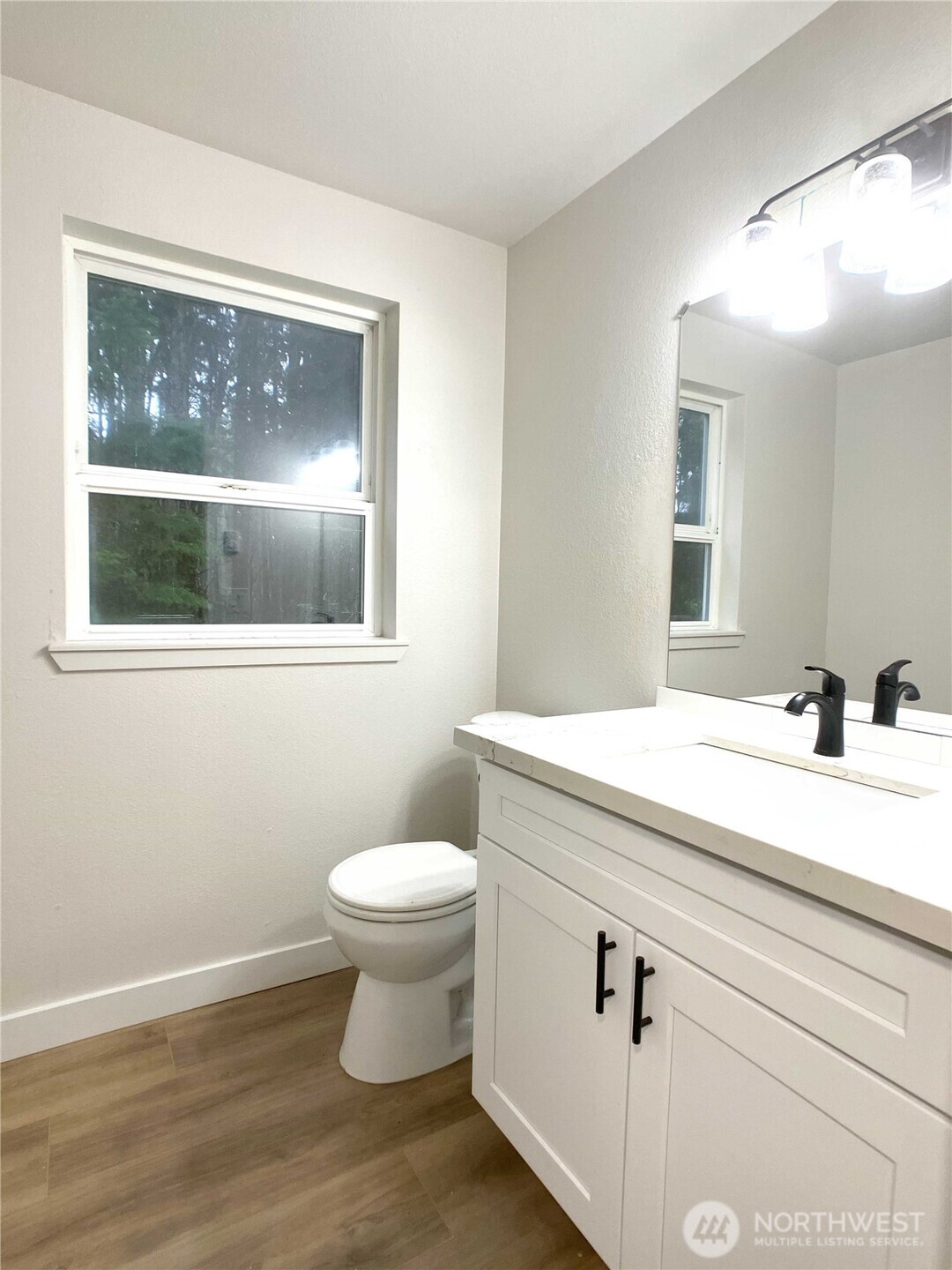 1471 Southeast Binns Swiger Loop Road Shelton, WA 98584 - Photo 12 of 25 a bathroom with a toilet a sink and mirror