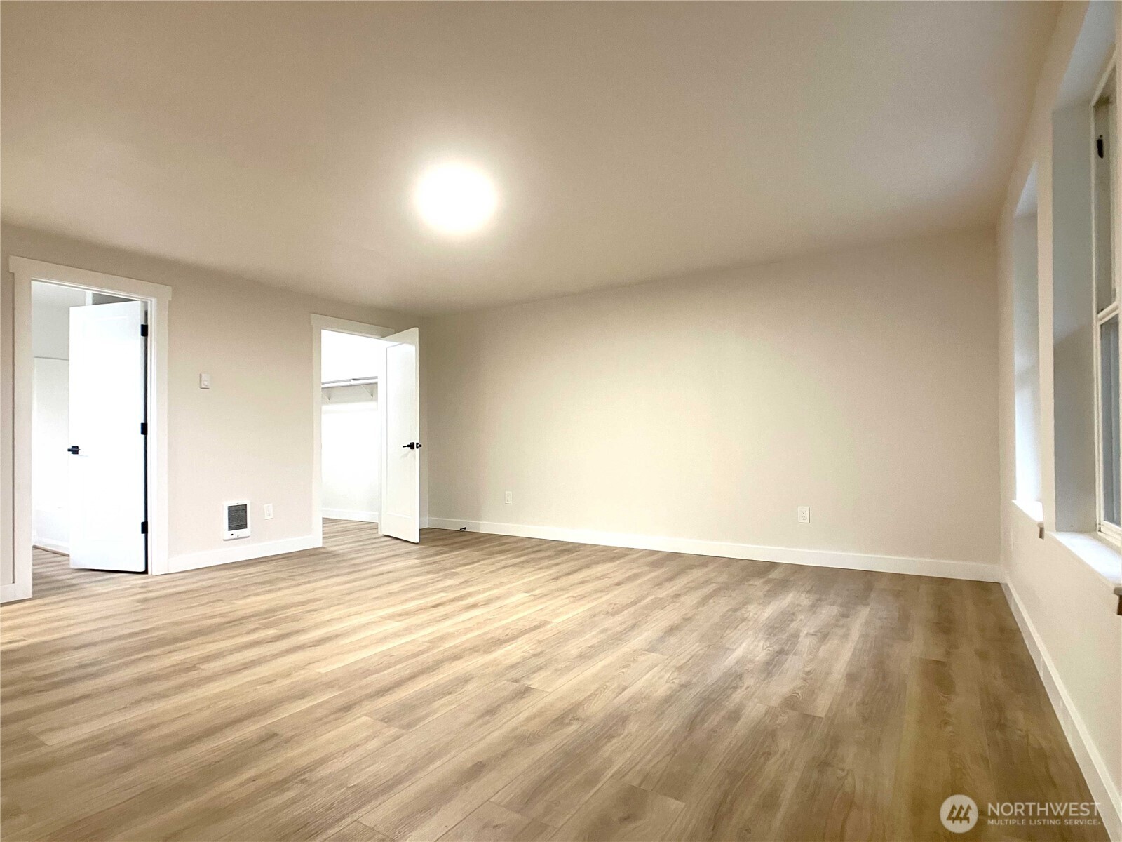 1471 Southeast Binns Swiger Loop Road Shelton, WA 98584 - Photo 14 of 25 an empty room with wooden floor and windows