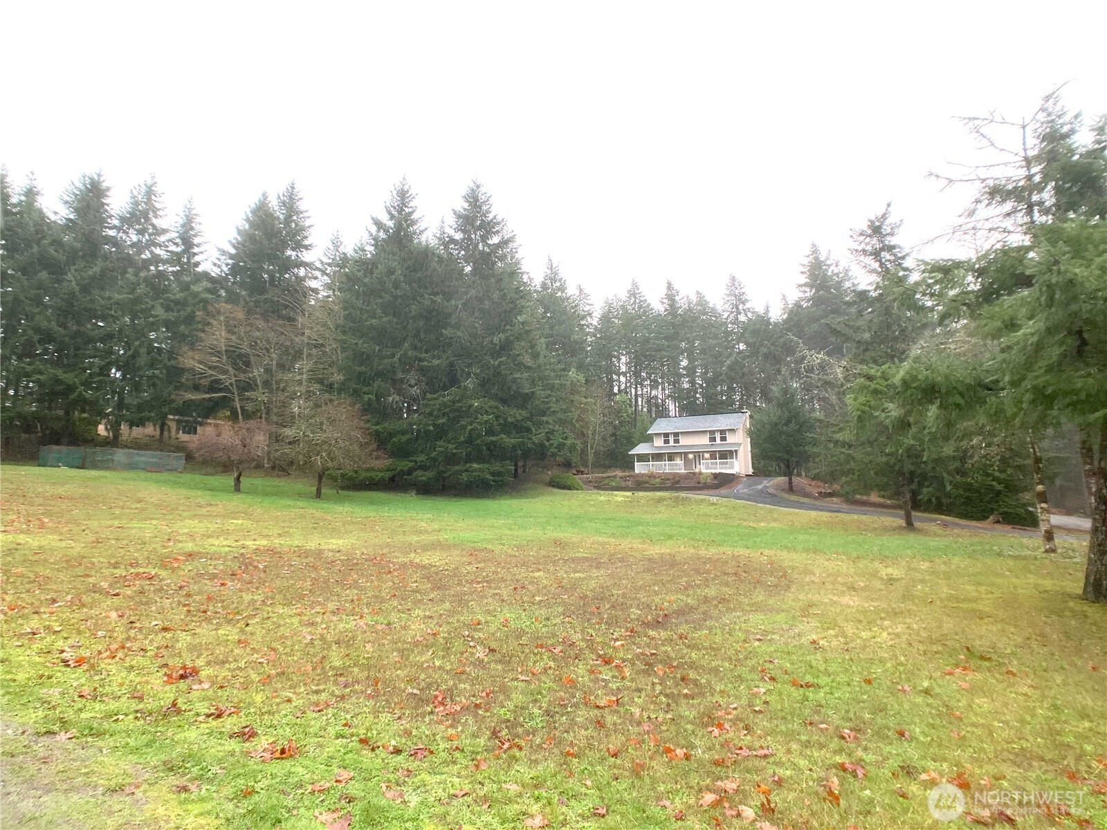 1471 Southeast Binns Swiger Loop Road Shelton, WA 98584 - Photo 19 of 25 a swimming pool with trees in the background
