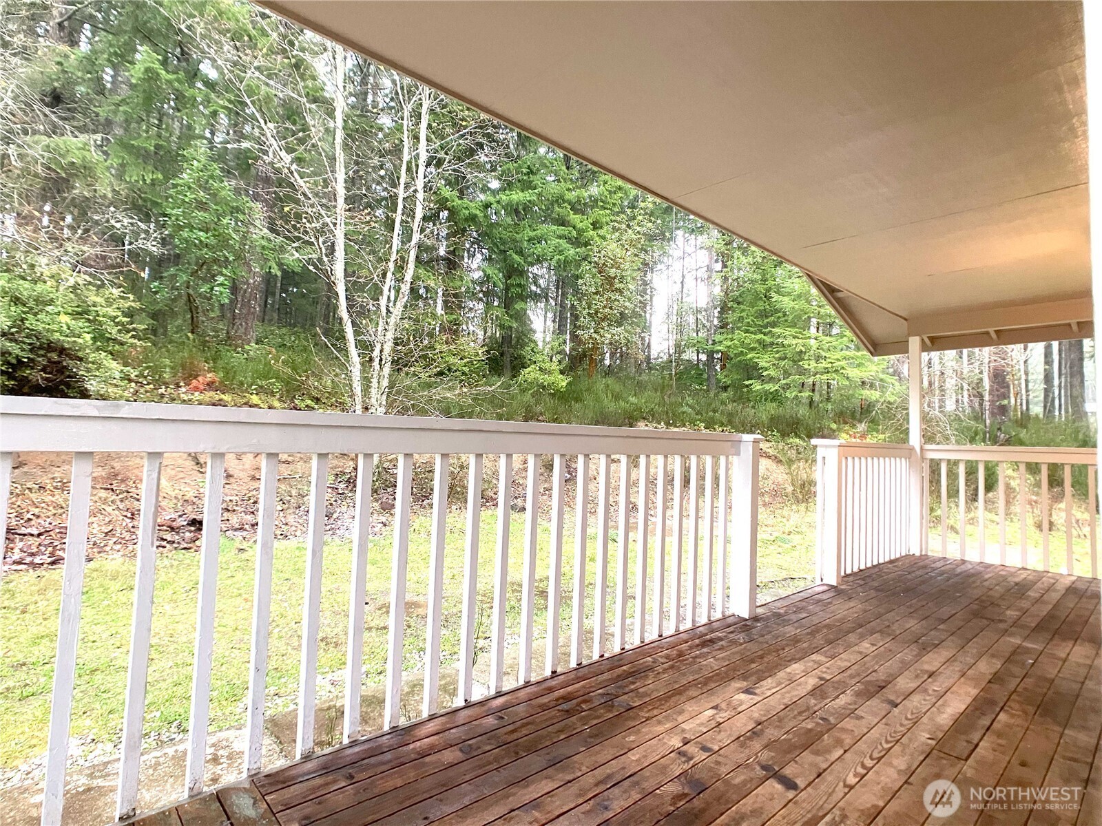 1471 Southeast Binns Swiger Loop Road Shelton, WA 98584 - Photo 22 of 25 a view of balcony with floor to ceiling window and wooden fence