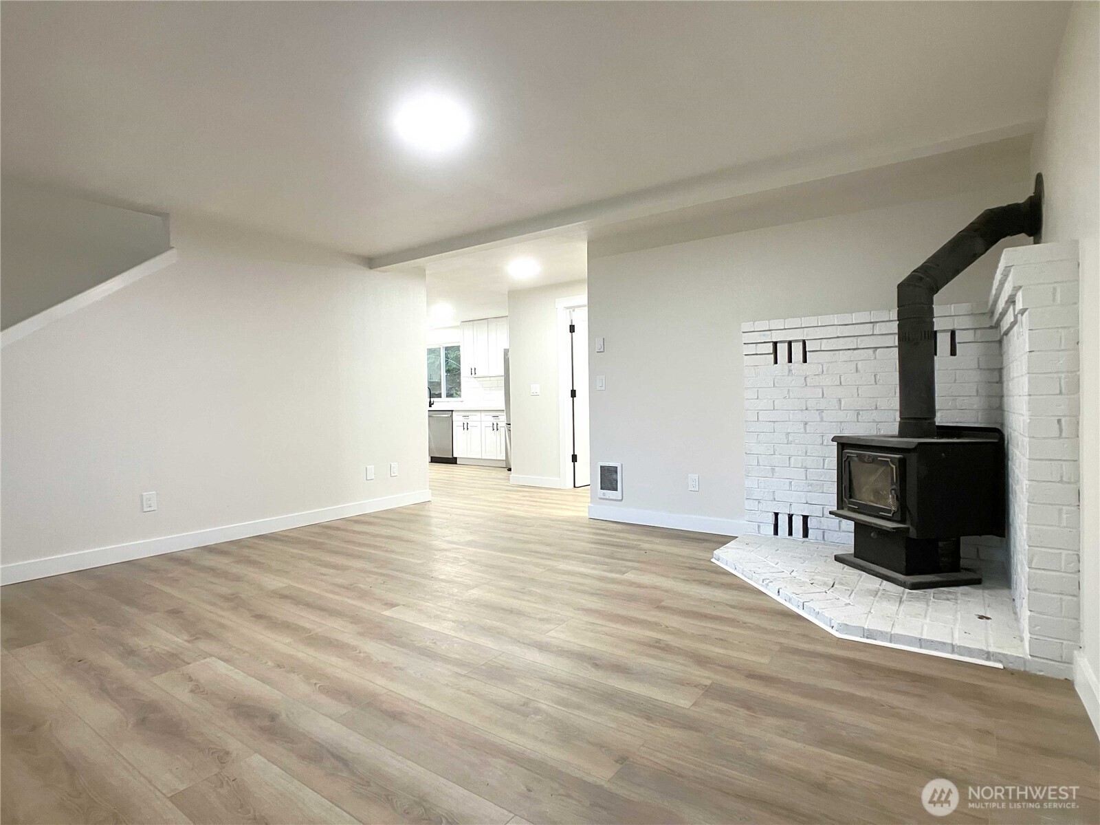 1471 Southeast Binns Swiger Loop Road Shelton, WA 98584 - Photo 4 of 25 a view of an empty room with wooden floor and a window