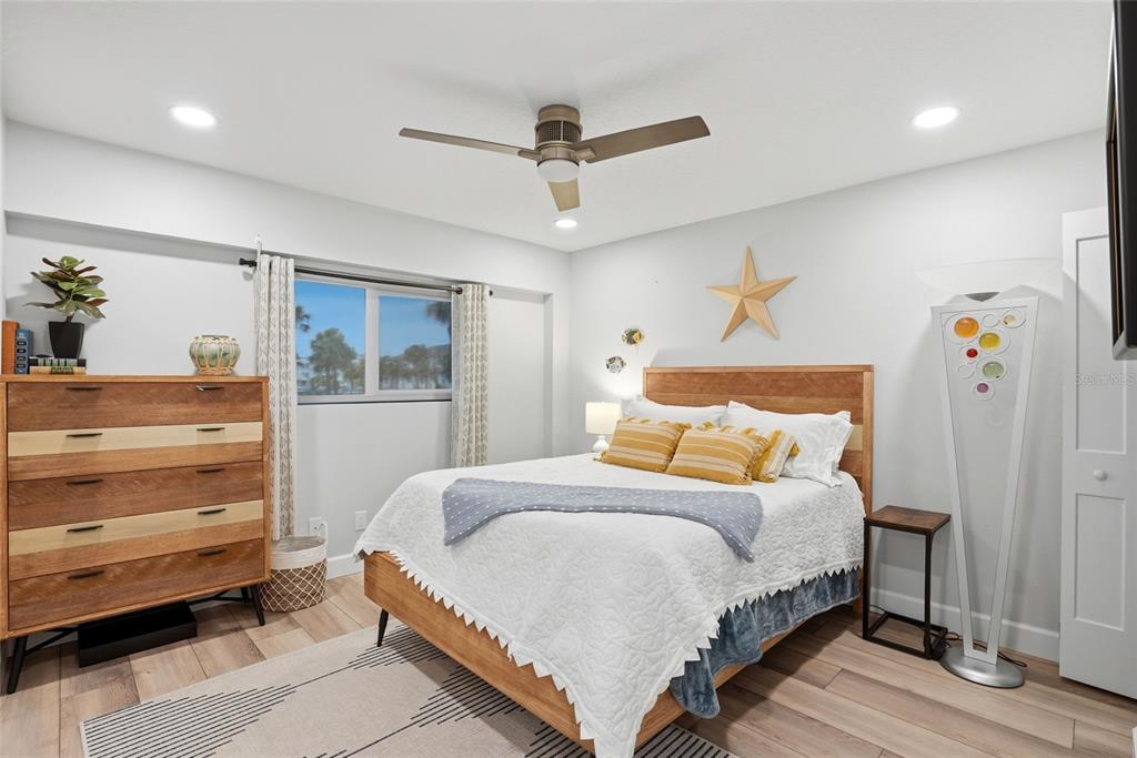 363 Pinellas Bayway South, Unit 29 Tierra Verde, FL 33715 - Photo 5 of 59 a bedroom with a bed and a dresser