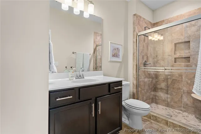 a balcony with wooden floor and outdoor seating