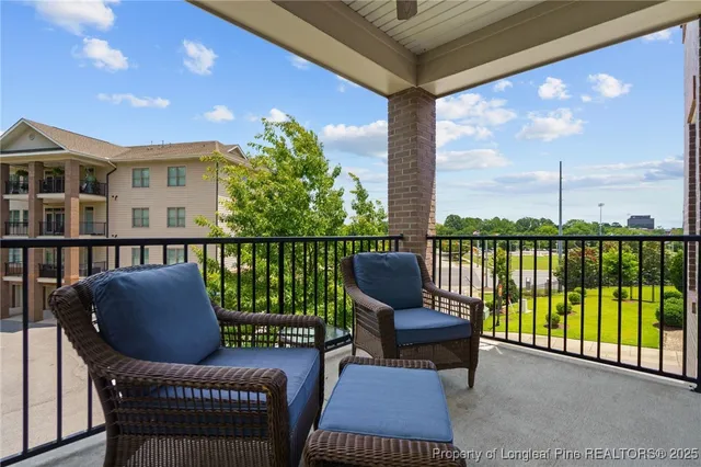 a view of a swimming pool with a yard