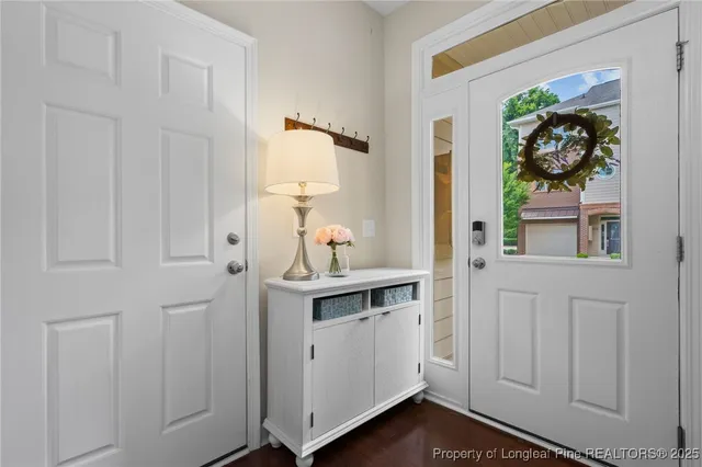 a view of a room with a table and a chairs