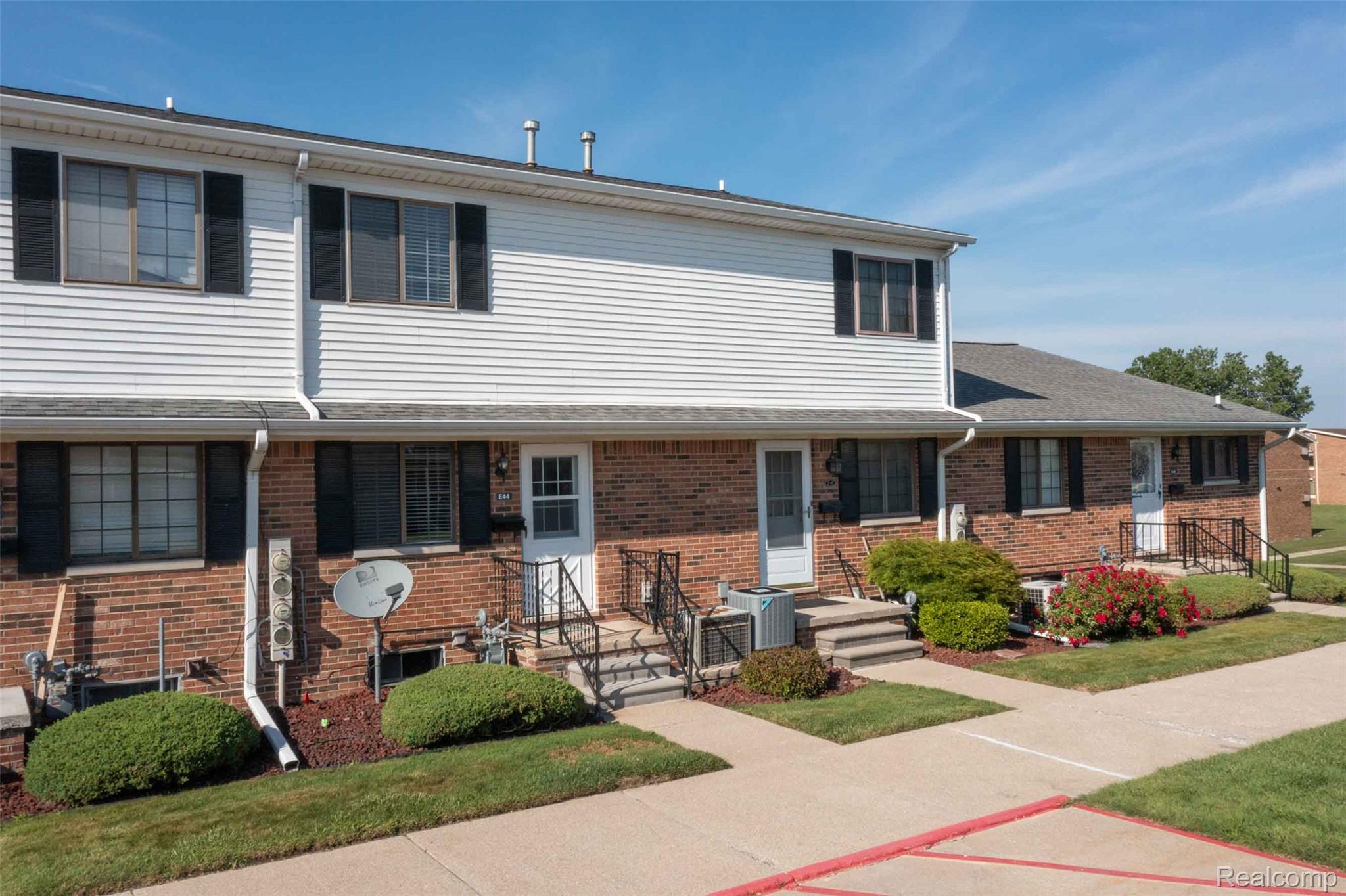 125 Cuttle Road Marysville, MI 48040 - Photo 2 of 44 Brick and vinyl siding exterior with black window shutters