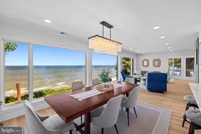 a living room with furniture window and wooden floor