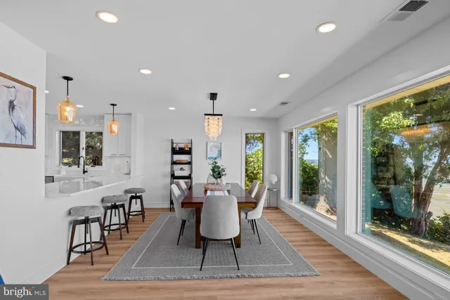 a view of entryway with wooden floor and windows