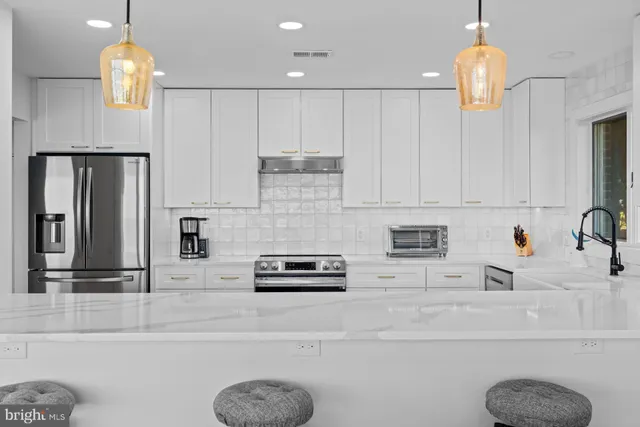 a bathroom with a sink and a large mirror