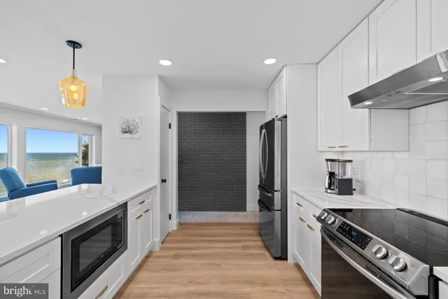 a bathroom with a sink mirror and toilet