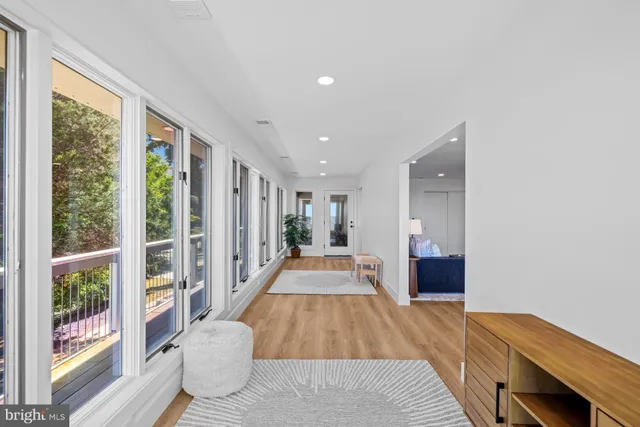 a bedroom with a large bed and a flat screen tv