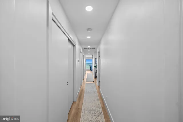 a bathroom with a sink toilet a mirror and shower