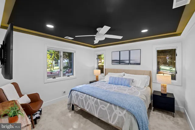 a balcony with furniture and a potted plant