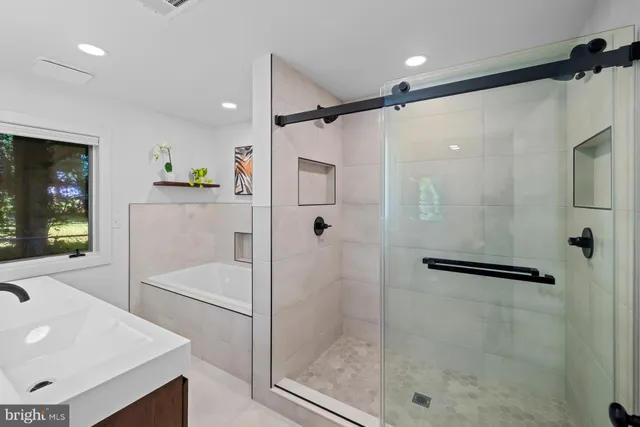 an aerial view of a house with a yard and garden