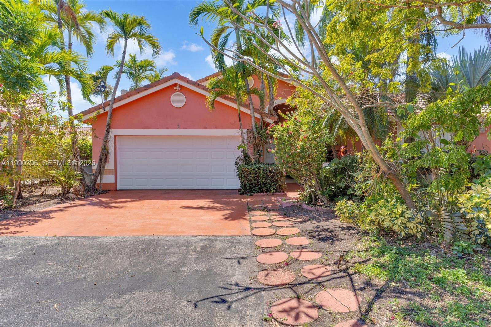 15012 Southwest 45th Lane Miami, FL 33185 - Photo 2 of 43 a front view of house with yard