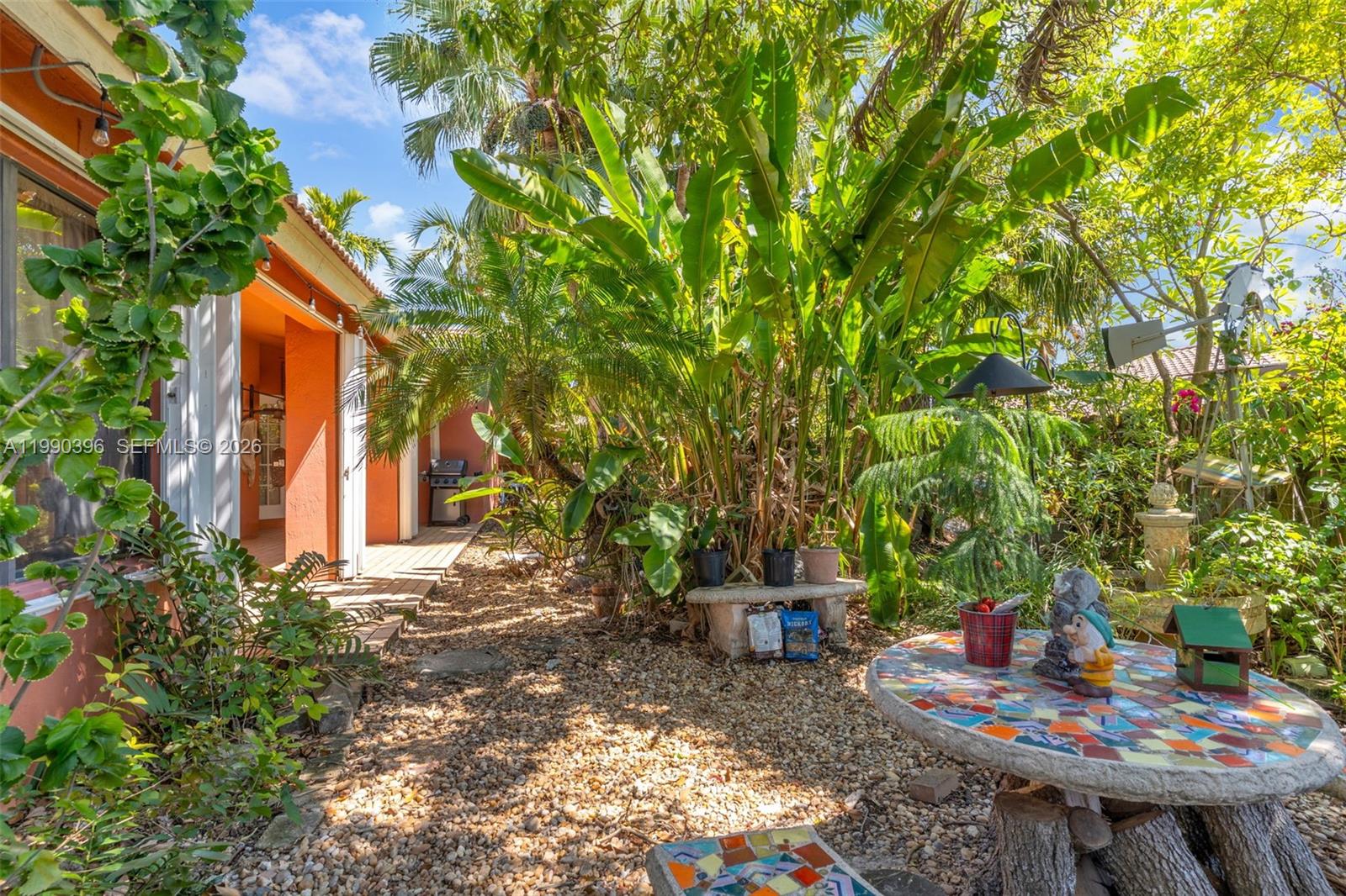 15012 Southwest 45th Lane Miami, FL 33185 - Photo 25 of 43 a backyard of a house with seating space