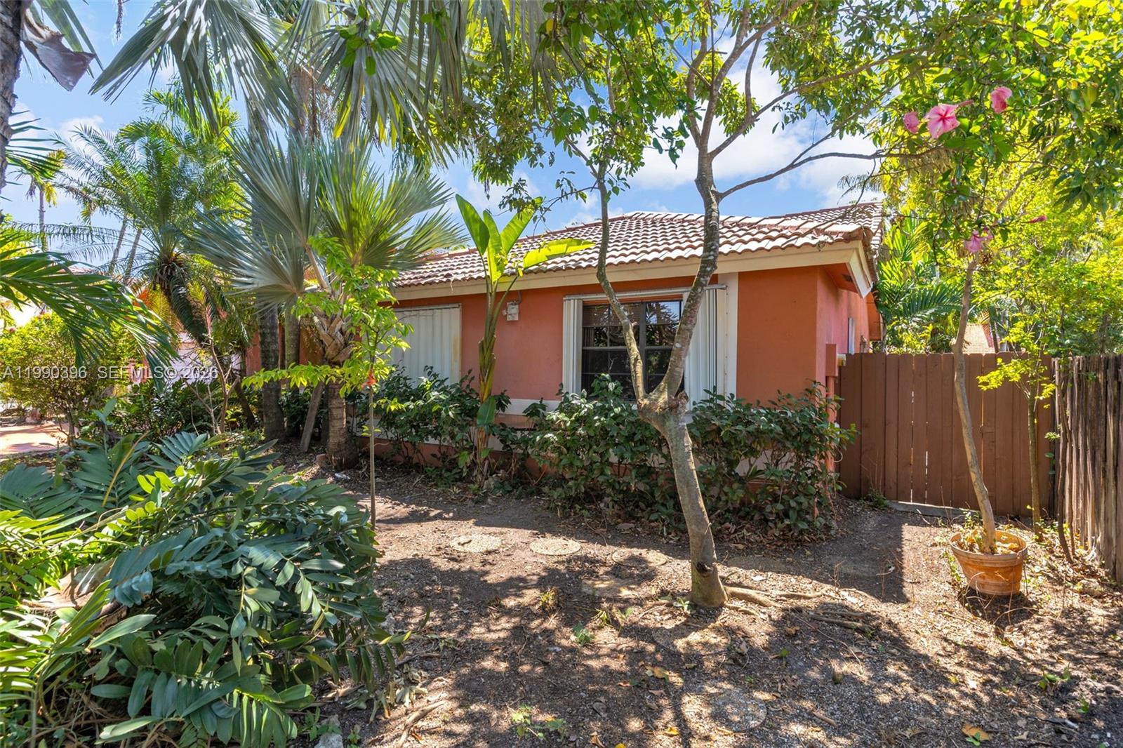 15012 Southwest 45th Lane Miami, FL 33185 - Photo 4 of 43 a view of a house with a tree in the background