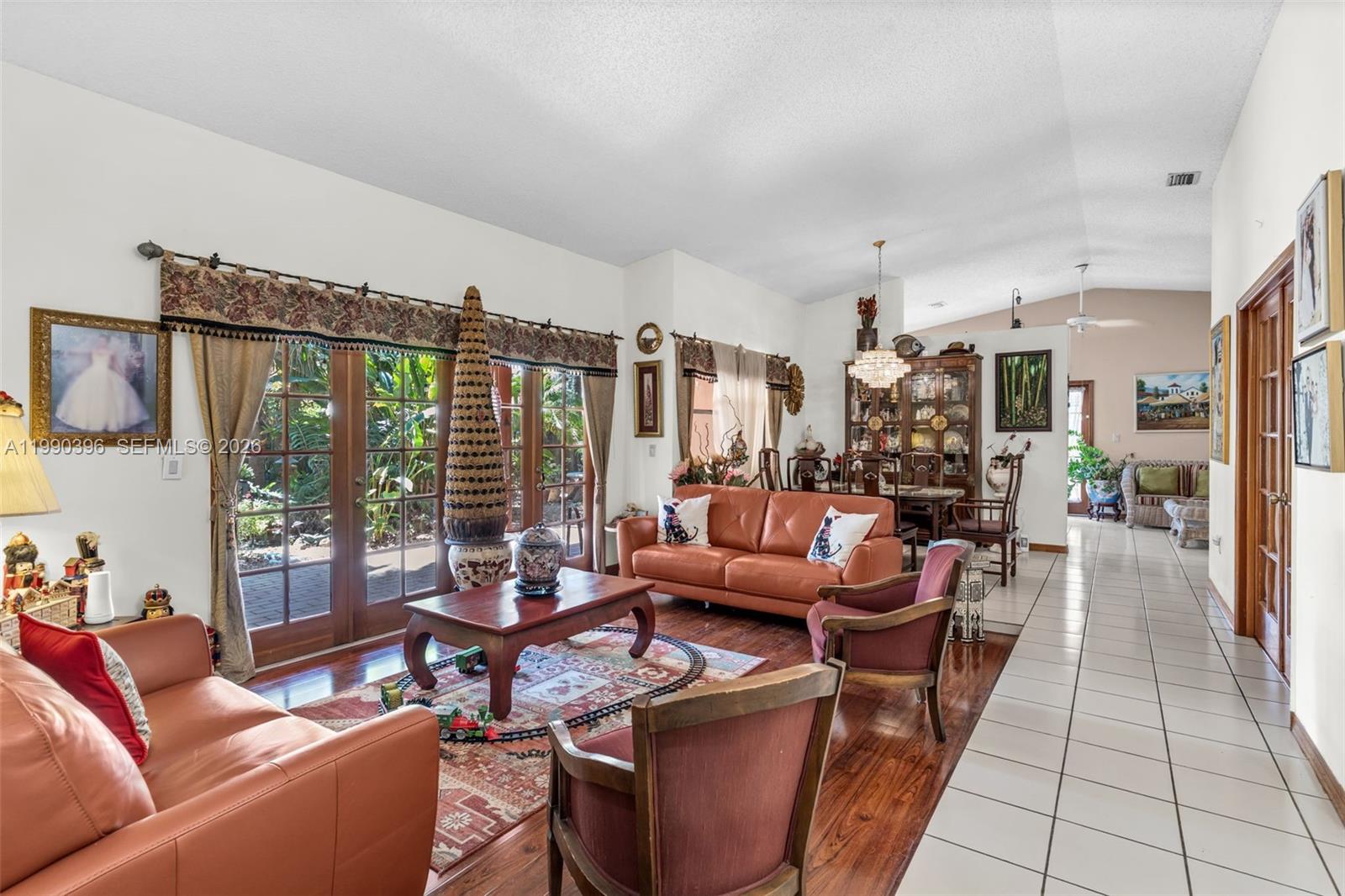 15012 Southwest 45th Lane Miami, FL 33185 - Photo 6 of 43 a living room with furniture and a large window
