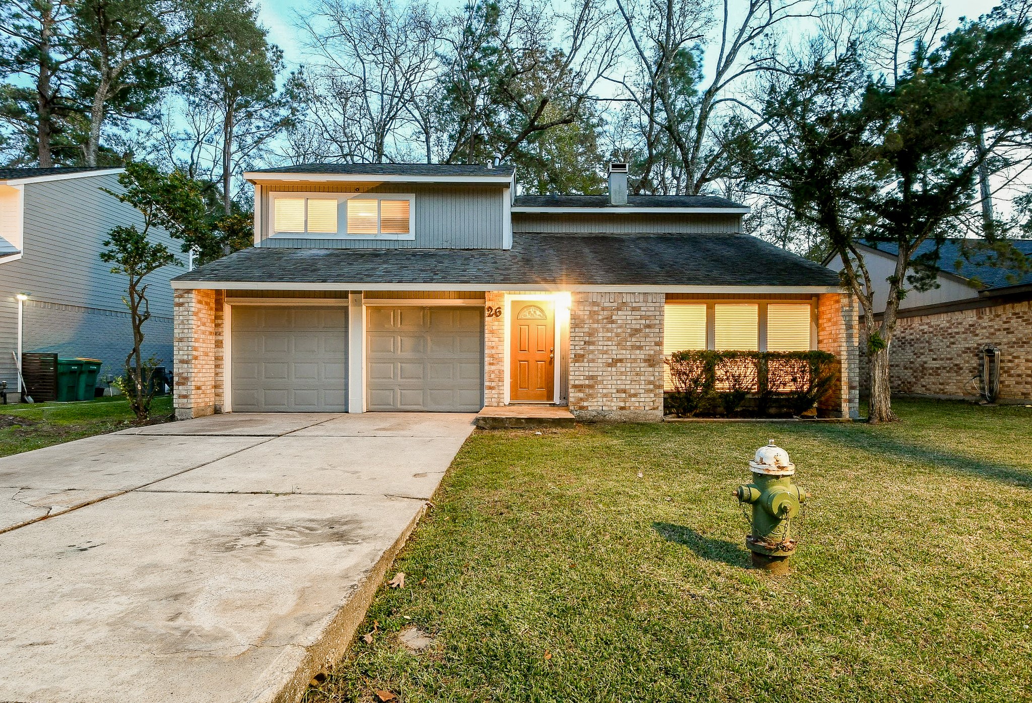 26 Yewleaf Road The Woodlands, TX 77381 - Photo 1 of 21 a front view of a house with garden