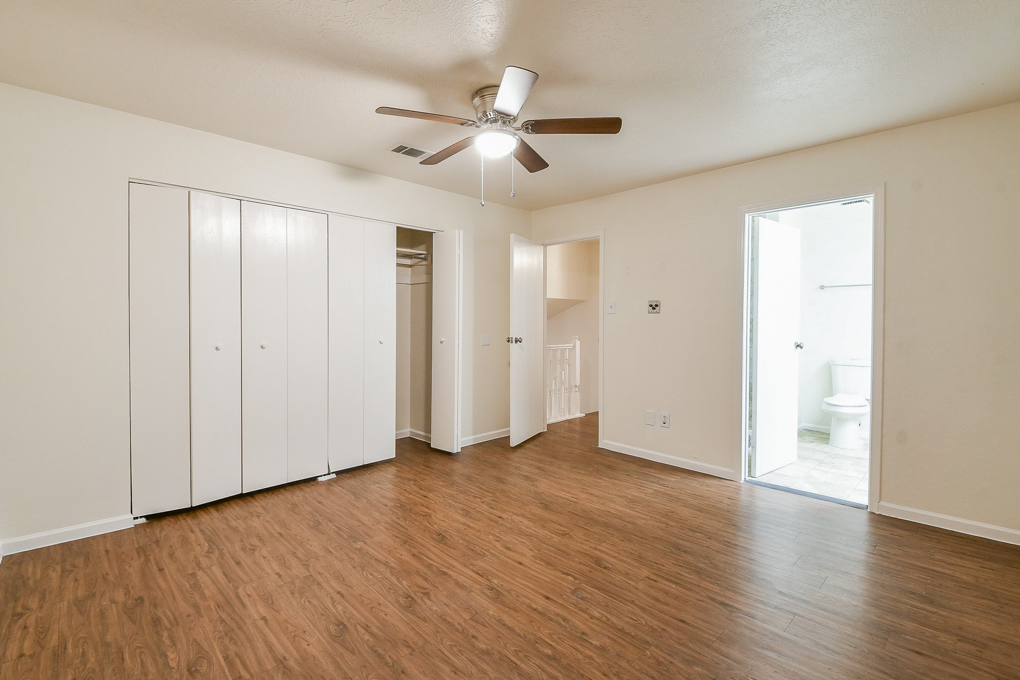 26 Yewleaf Road The Woodlands, TX 77381 - Photo 12 of 21 a view of an empty room with wooden floor