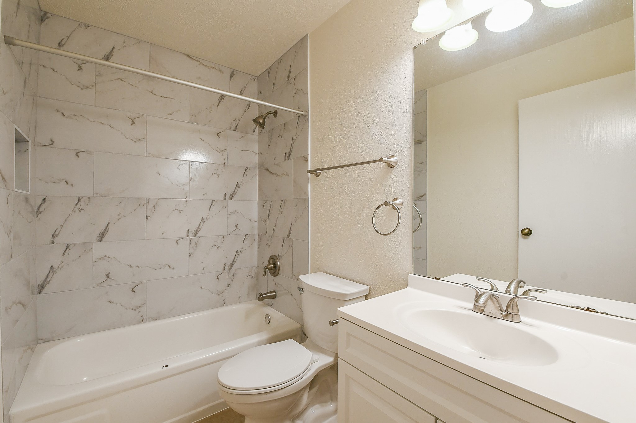 26 Yewleaf Road The Woodlands, TX 77381 - Photo 18 of 21 a bathroom with a sink toilet vanity and shower