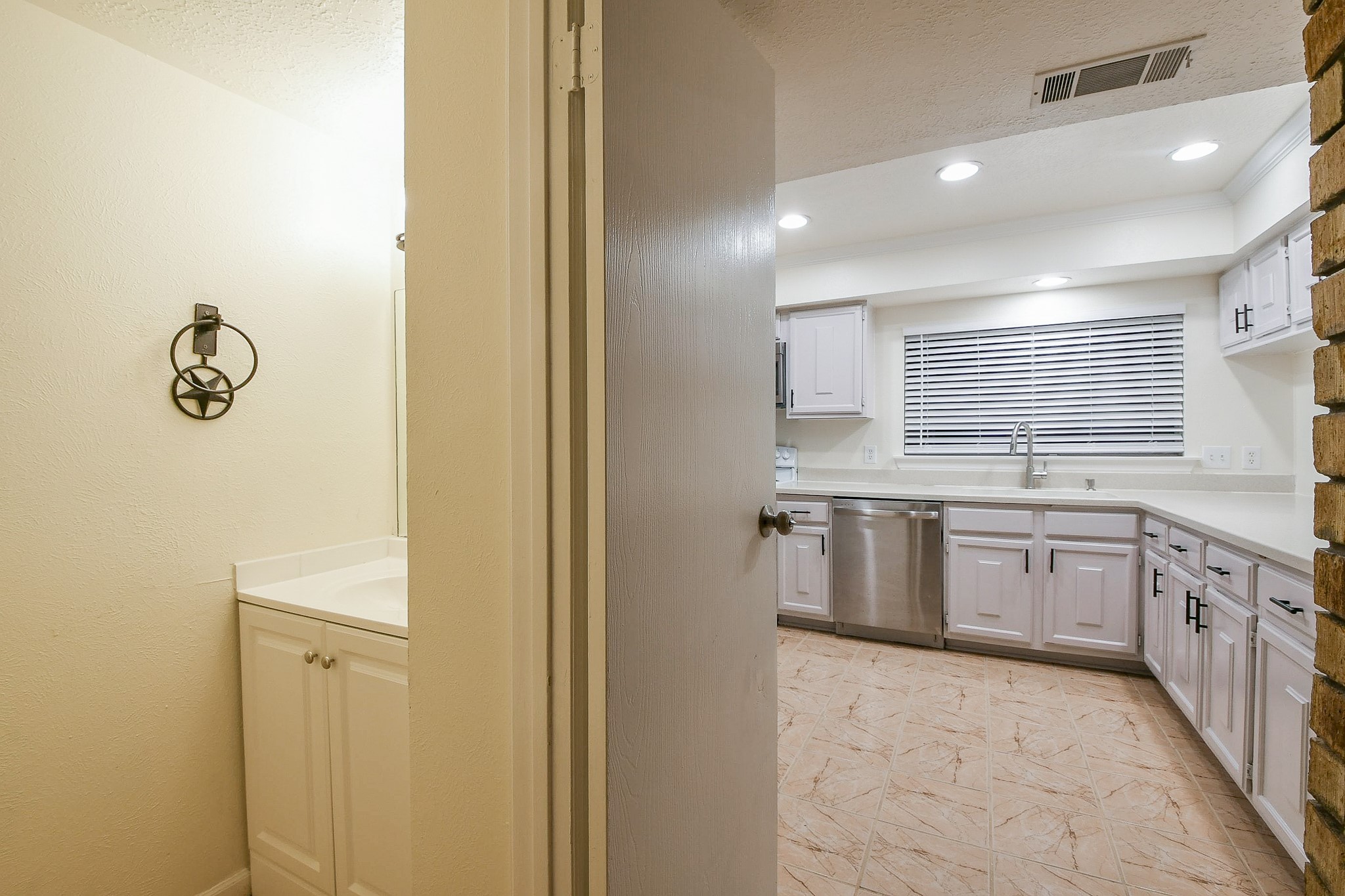 26 Yewleaf Road The Woodlands, TX 77381 - Photo 10 of 21 a large bathroom with a granite countertop sink a washer and dryer