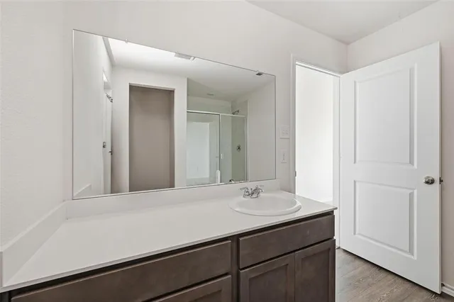 a kitchen with granite countertop a sink and a stove top oven