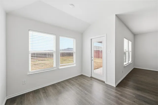 a view of a kitchen with a sink and a stove top oven