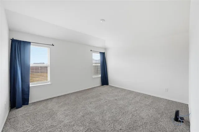 a kitchen with a stove a sink and a refrigerator