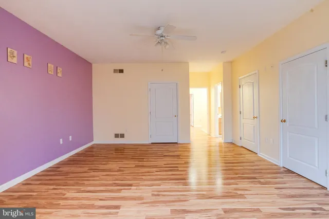 a view of a backyard with large trees
